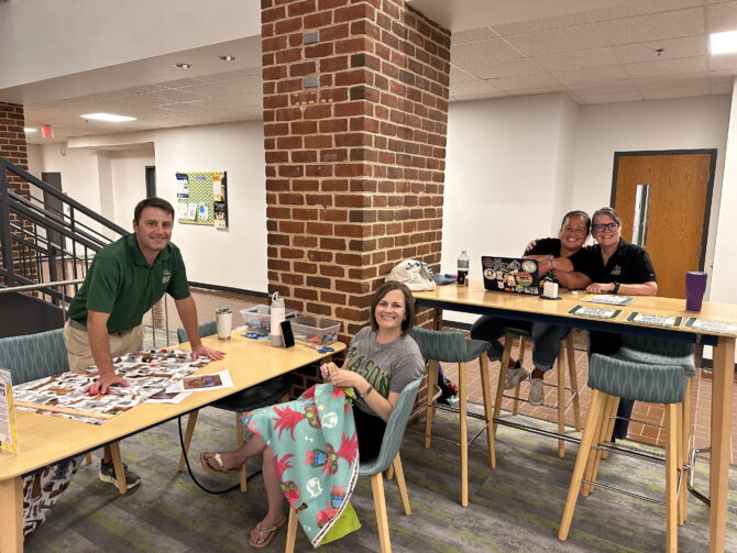 University Life staff at event tables on University Life Day of Service